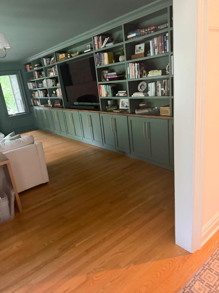 Custom green built-in library millwork