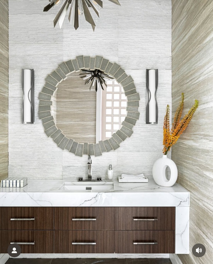 Floating dark walnut vanity with waterfall marble top